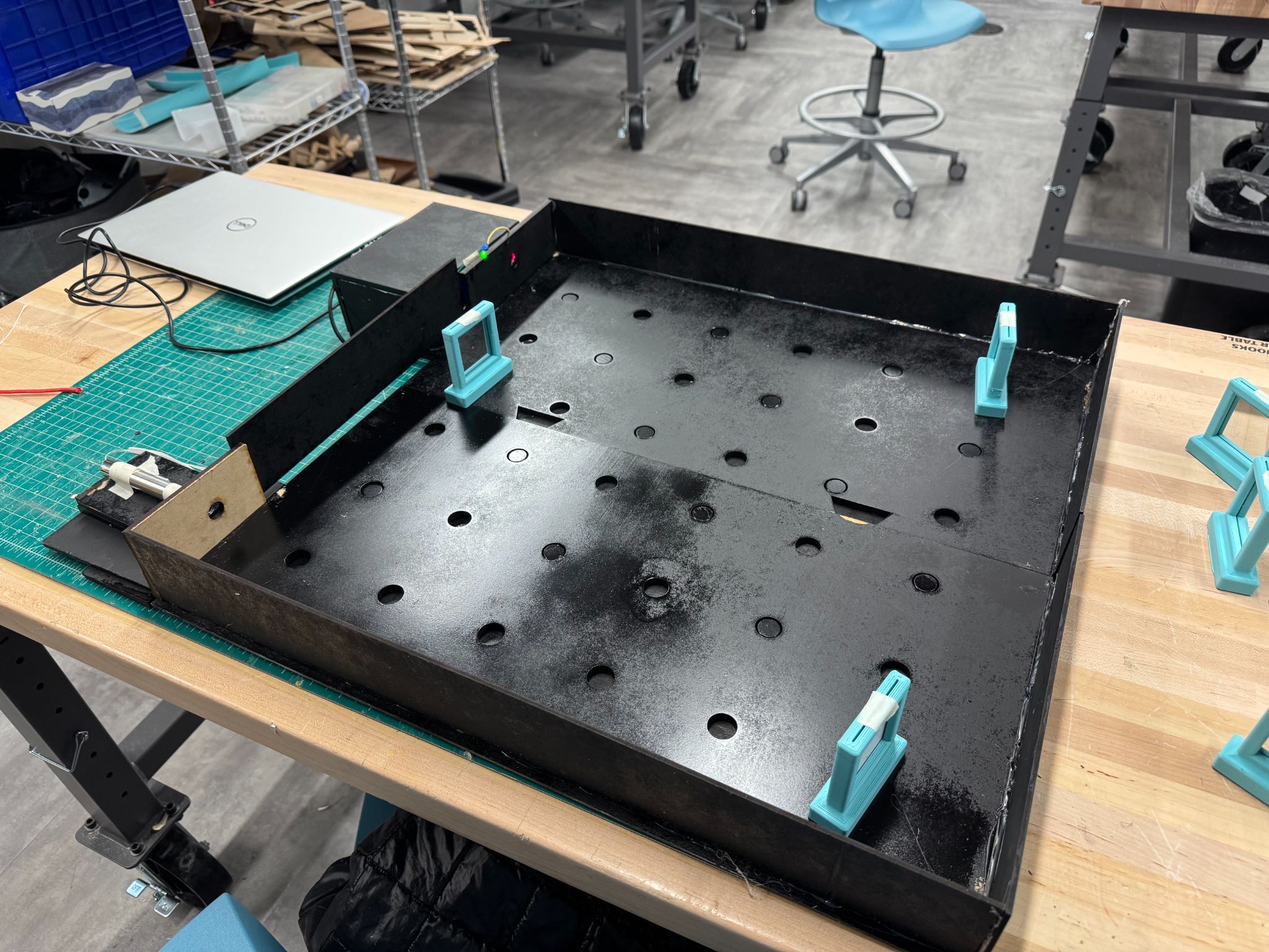 Laser-cut MDF maze enclosure painted matte black